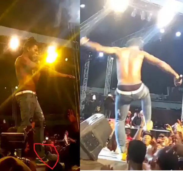Angry Burna Boy almost attack fan who untied and allegedly took one of shoes while performing at Phyno’s concert (Video)